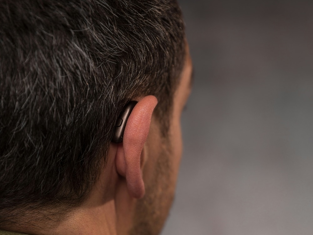 Doctor of Audiology programming a new hearing aid during a fitting at Brighter Hearing in Savannah, GA