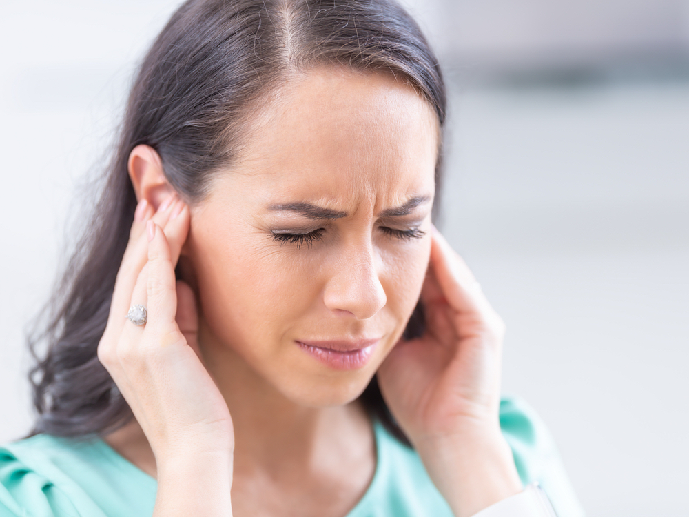 Doctor of Audiology evaluating a patient for tinnitus and ringing in the ears at Brighter Hearing in Savannah, GA